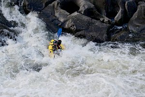 Rafter obscured in rapids