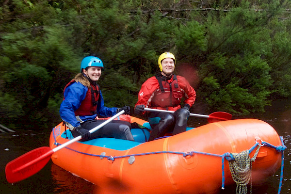 Two whitewater rafters on a river