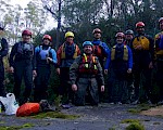 Group of people wearing whitewater rafting gear