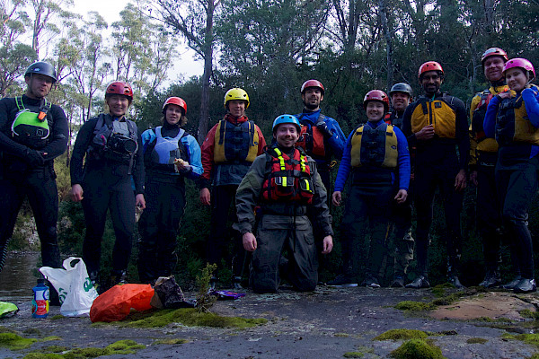 Group of people wearing whitewater rafting gear