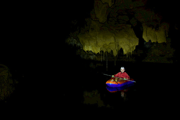 Author in a raft on an underground lake
