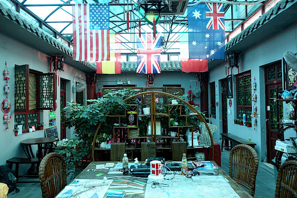 Hostel with flags hanging from the ceiling